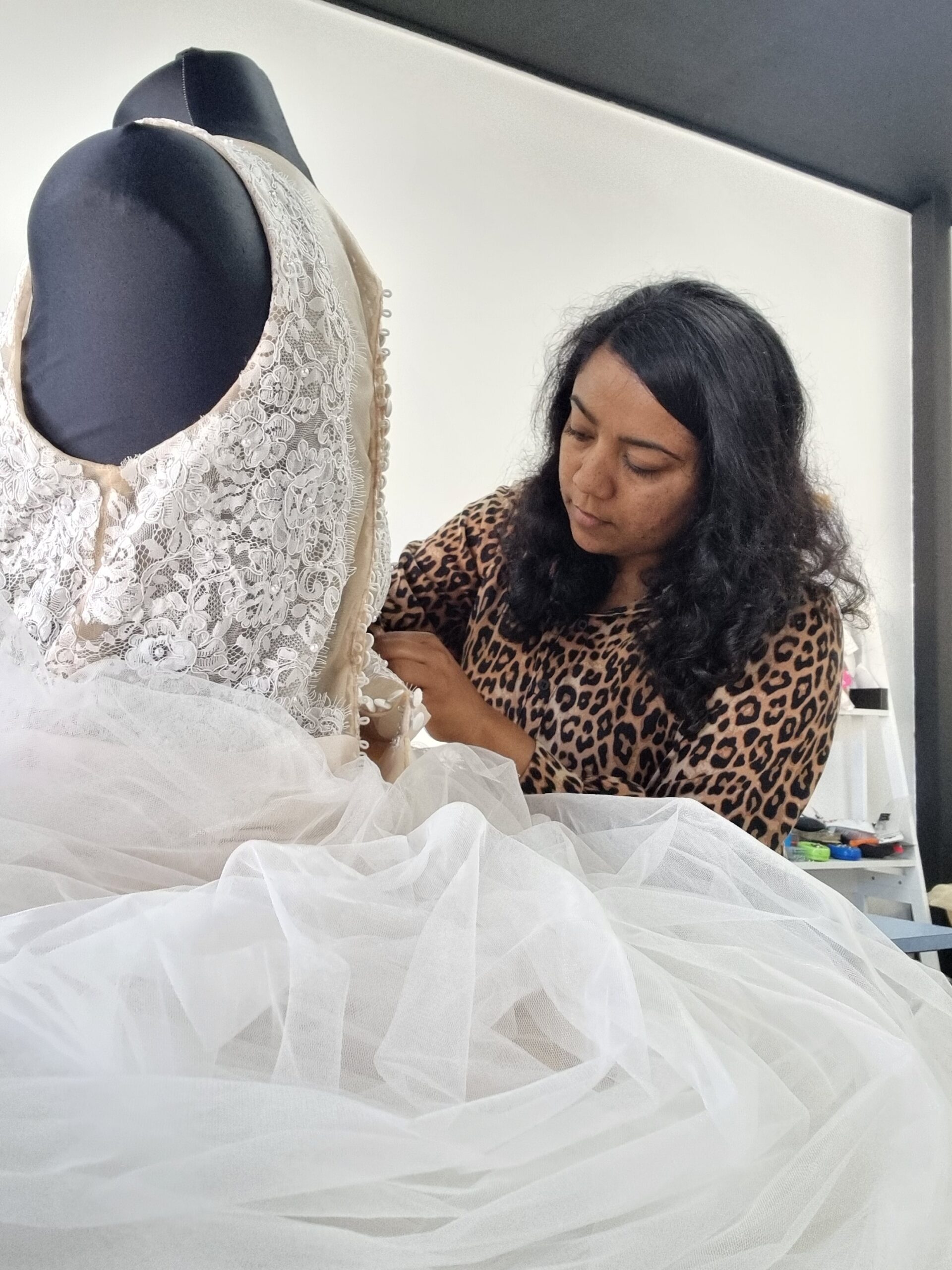 Navi working on a wedding dress